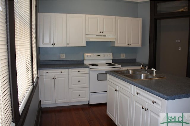 kitchen featuring white cabinetry, a wealth of natural light, and electric stove