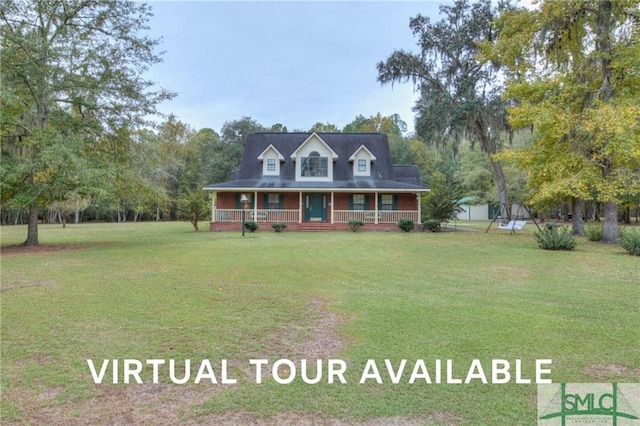 farmhouse inspired home featuring covered porch and a front yard