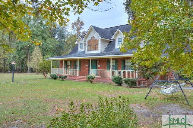 view of front of house with covered porch and a front lawn