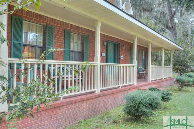 view of property exterior with covered porch