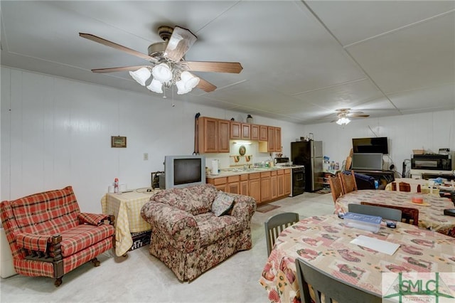 living room with ceiling fan and light colored carpet