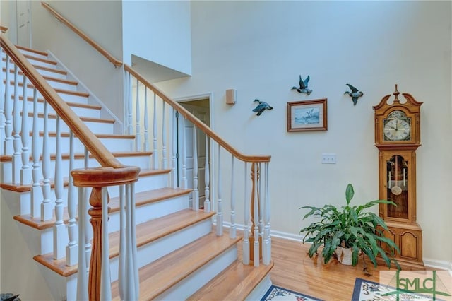 stairway featuring light hardwood / wood-style flooring