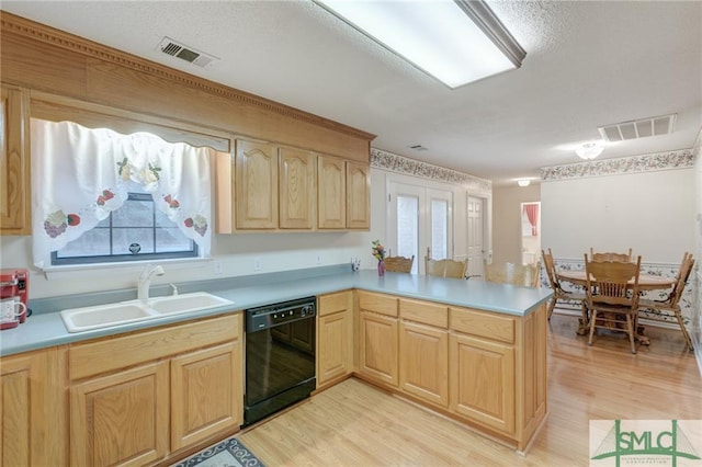 kitchen featuring light brown cabinetry, light hardwood / wood-style floors, dishwasher, sink, and kitchen peninsula