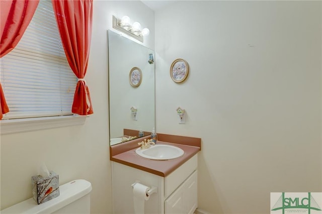 bathroom with oversized vanity and toilet