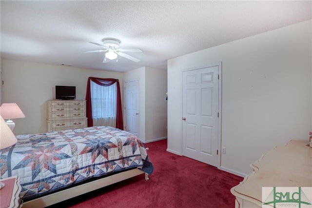 bedroom featuring ceiling fan and dark colored carpet