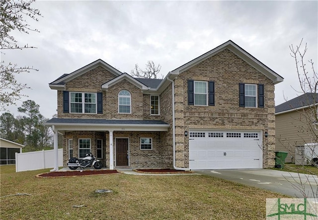 view of front of house with a front lawn and a garage