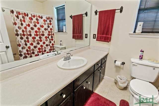 bathroom featuring toilet, tile flooring, and vanity