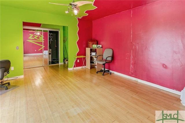 sitting room with ceiling fan and light hardwood / wood-style floors