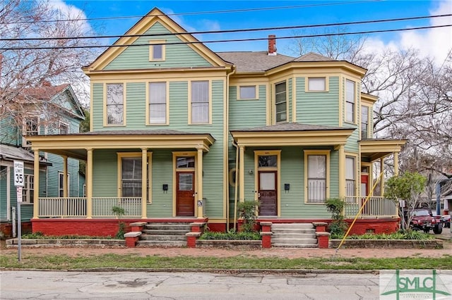 victorian home featuring covered porch