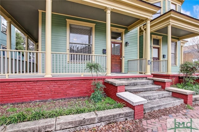 property entrance with covered porch