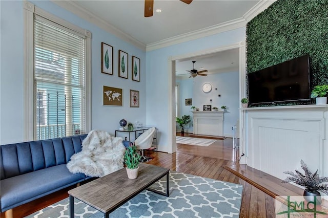 living room featuring ceiling fan, crown molding, and dark hardwood / wood-style floors