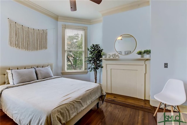 bedroom with ornamental molding, ceiling fan, and dark wood-type flooring