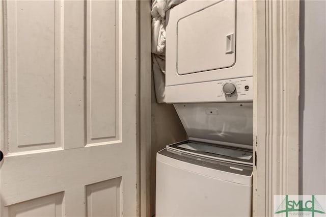 laundry room with stacked washer / dryer