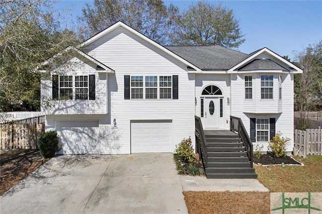 bi-level home featuring a garage