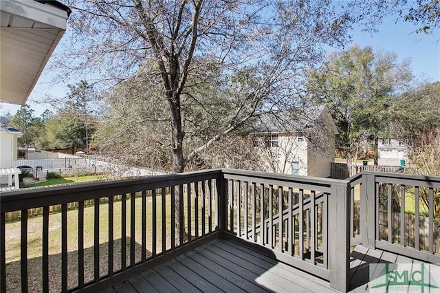 wooden deck with a yard