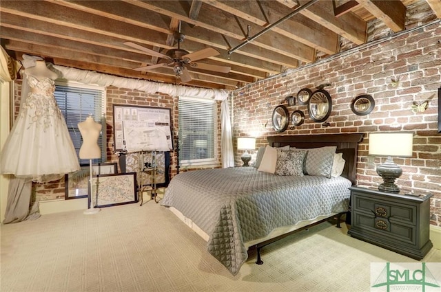 bedroom featuring brick wall and light carpet