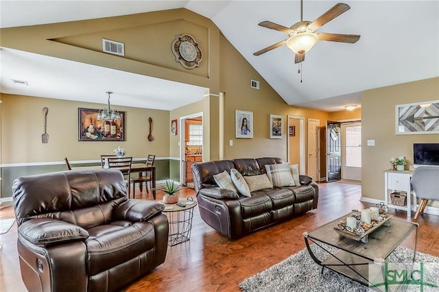 living room with high vaulted ceiling, ceiling fan, and dark wood-type flooring