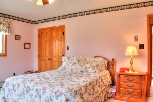 bedroom with ceiling fan and light colored carpet