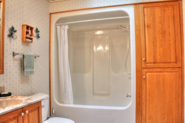 full bathroom featuring toilet, vanity, and shower / bathtub combination with curtain