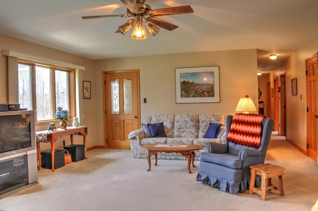 living room with ceiling fan and light carpet