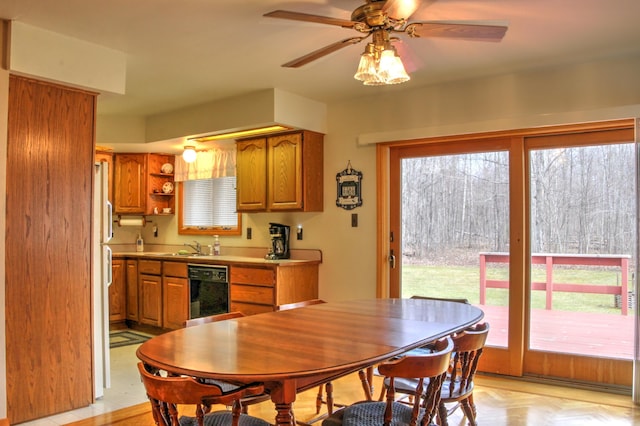 interior space featuring light parquet flooring, a healthy amount of sunlight, ceiling fan, and dishwasher