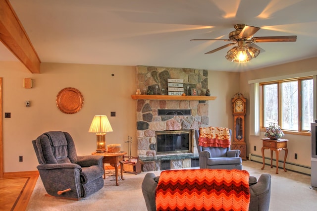 living room with ceiling fan, a stone fireplace, light colored carpet, and baseboard heating