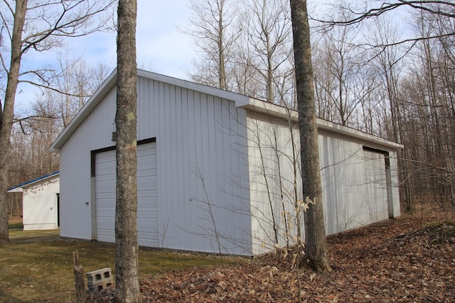 view of side of home featuring a garage