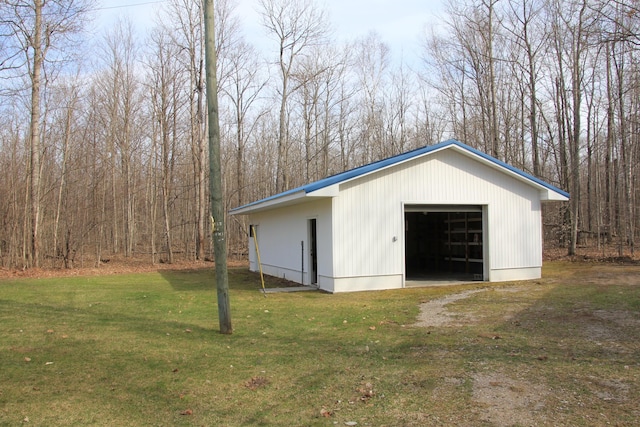 garage featuring a yard