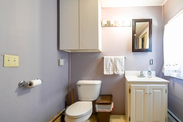 bathroom featuring toilet and vanity