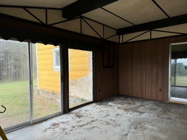 unfurnished sunroom featuring a healthy amount of sunlight