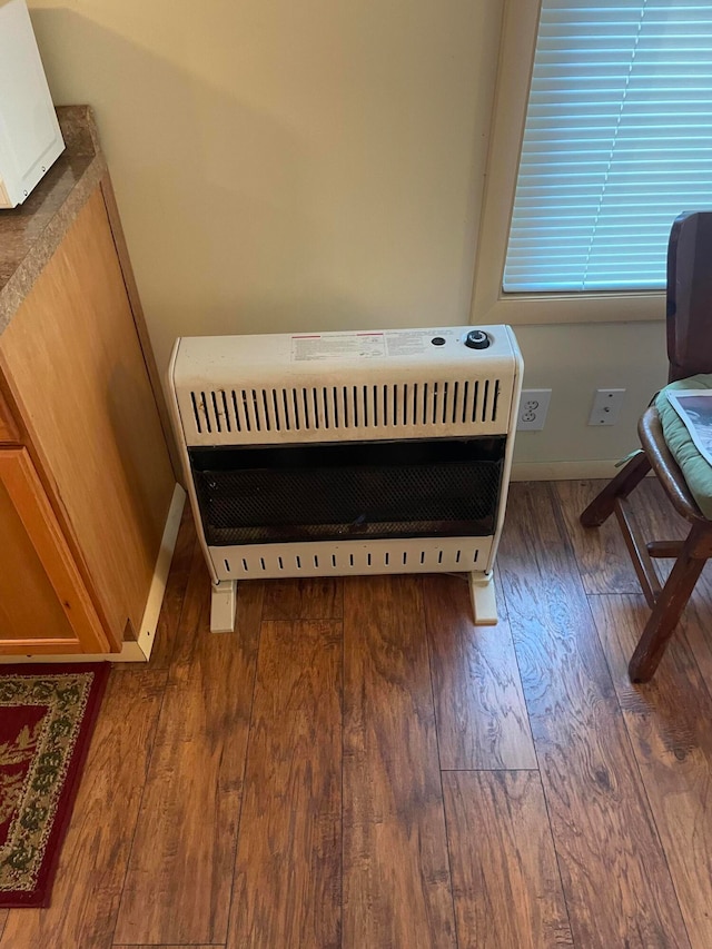 interior details with radiator and dark wood-type flooring