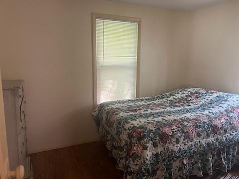 bedroom featuring dark hardwood / wood-style floors