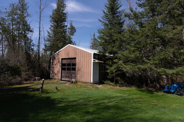 view of shed / structure with a lawn