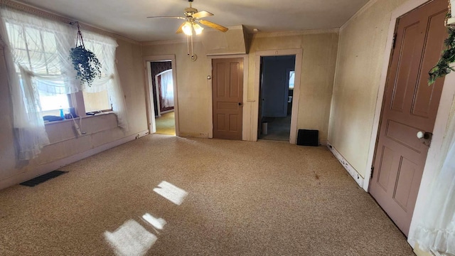 unfurnished bedroom with light carpet, ornamental molding, and ceiling fan