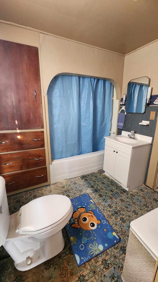 bathroom featuring toilet and vanity