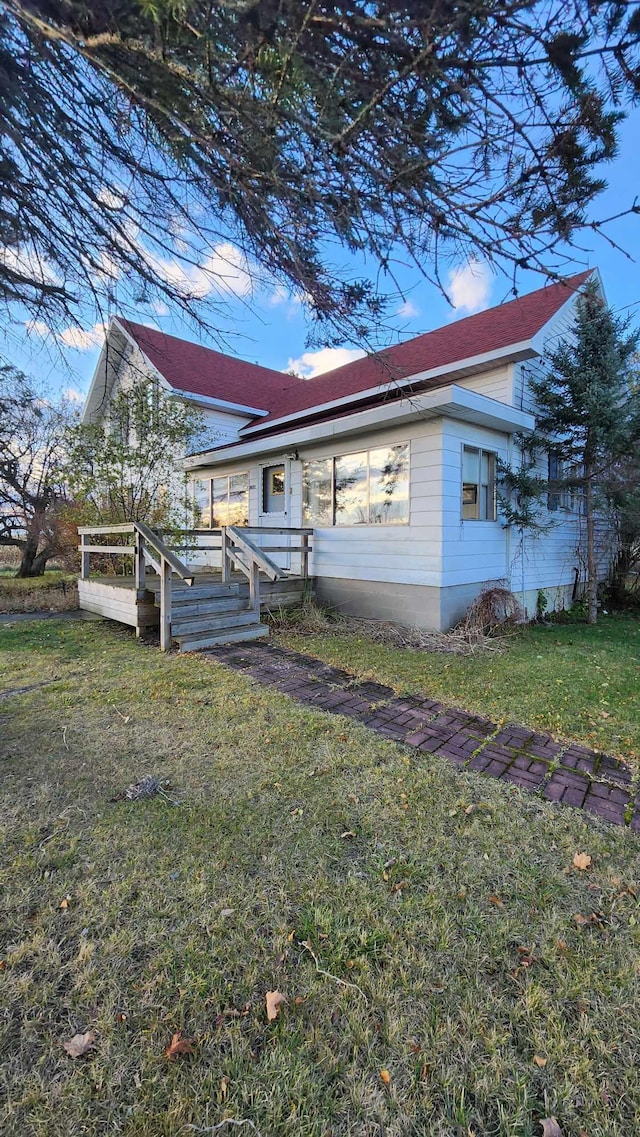 back of house with a yard