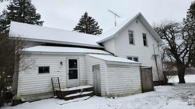 view of snow covered house