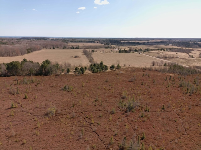 birds eye view of property with a rural view