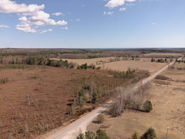 birds eye view of property with a rural view