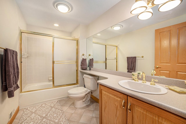 full bathroom featuring toilet, an inviting chandelier, tile floors, combined bath / shower with glass door, and large vanity