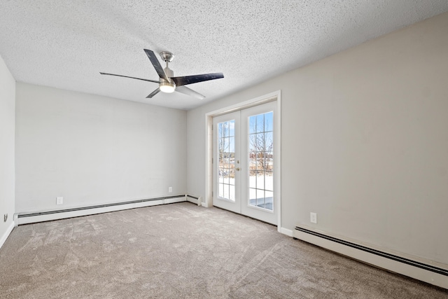 carpeted spare room featuring a textured ceiling, ceiling fan, baseboard heating, and french doors