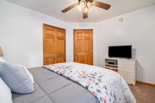 bedroom featuring carpet, ceiling fan, and a closet