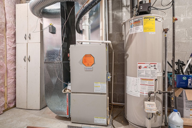 utility room featuring gas water heater and heating utilities