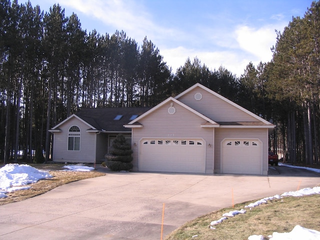 single story home featuring a garage