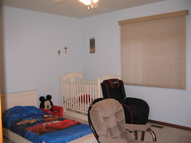 bedroom featuring ceiling fan and carpet floors