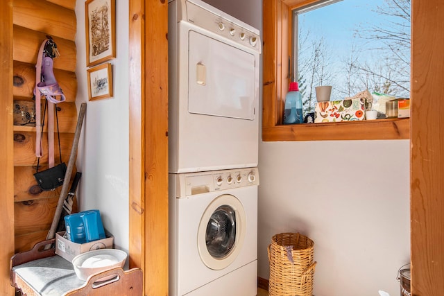 laundry area featuring stacked washer and dryer