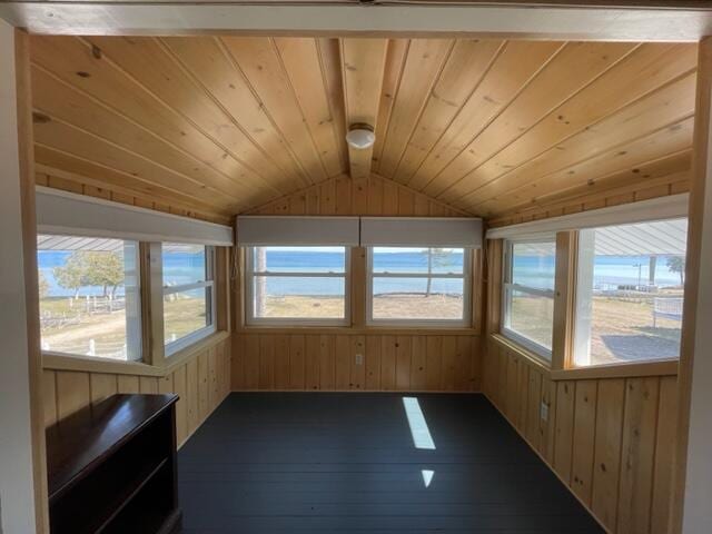 unfurnished sunroom featuring vaulted ceiling and wooden ceiling