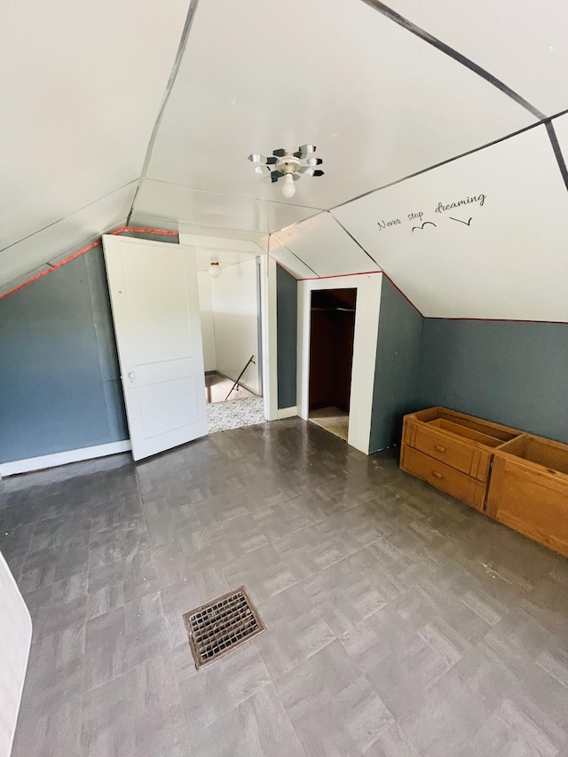 bonus room featuring vaulted ceiling