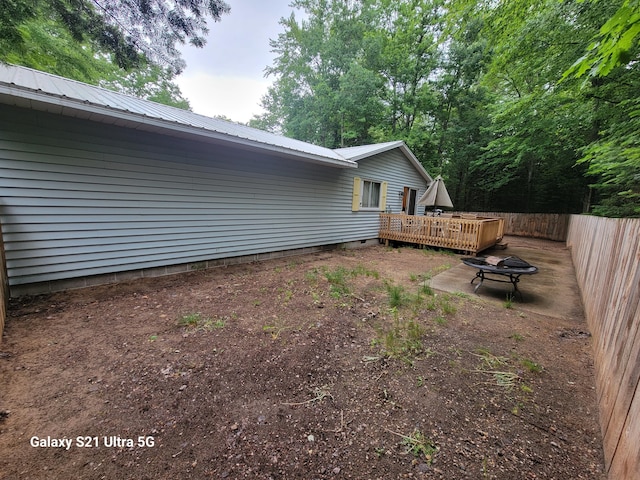 view of yard featuring a wooden deck