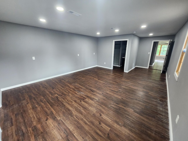 empty room featuring dark hardwood / wood-style flooring